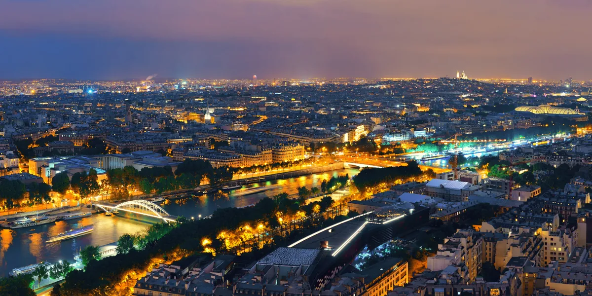 Paris city skyline with Seine river at dusk