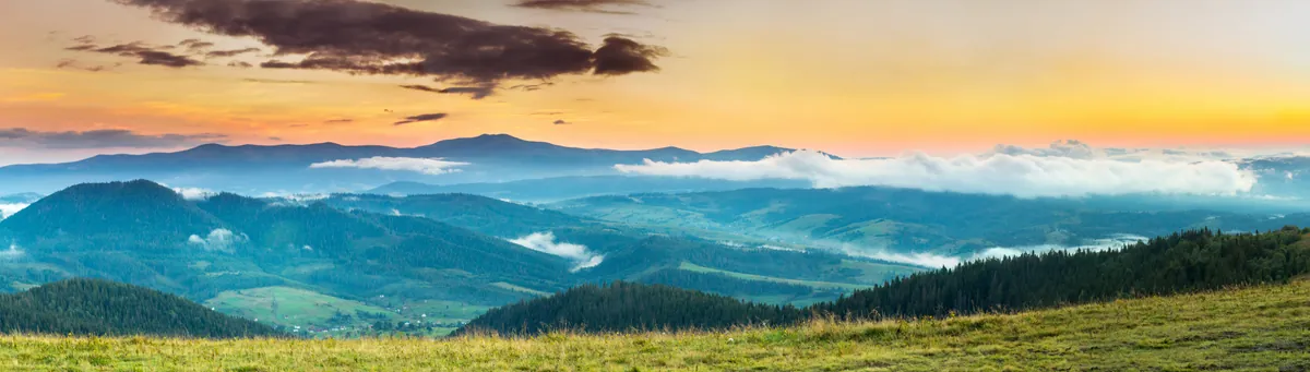 Autumn landscape with fog and mountains