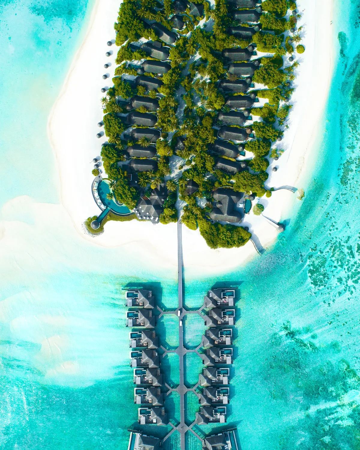 Aerial view of Maldives island houses on turquoise water